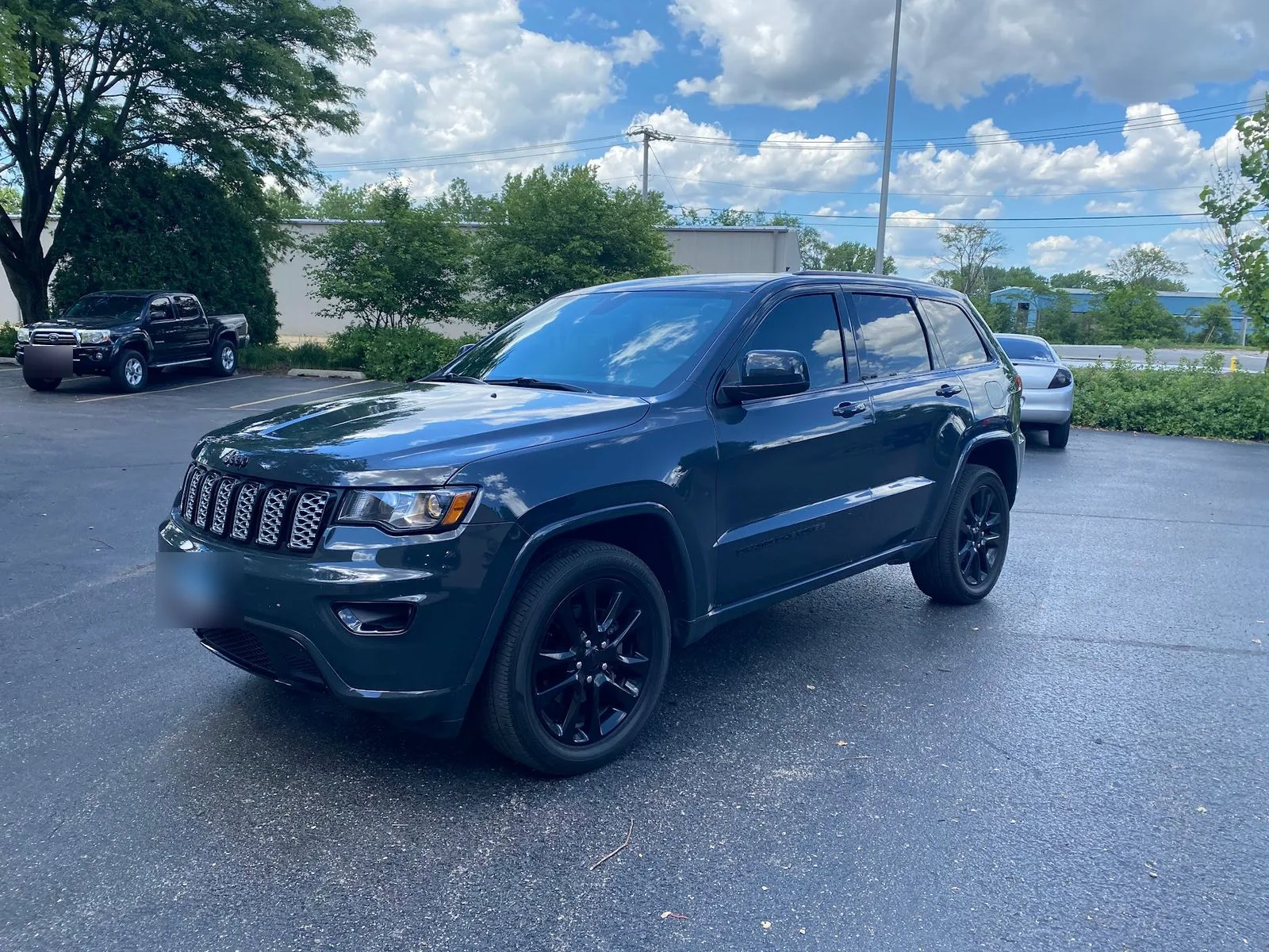 Tinted Jeep Grand Cherokee parked outside the MES shop